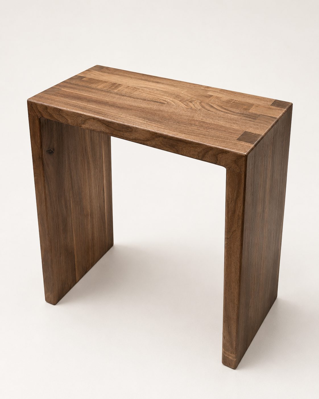 Solid walnut waterfall side table with exposed keyed corner joinery